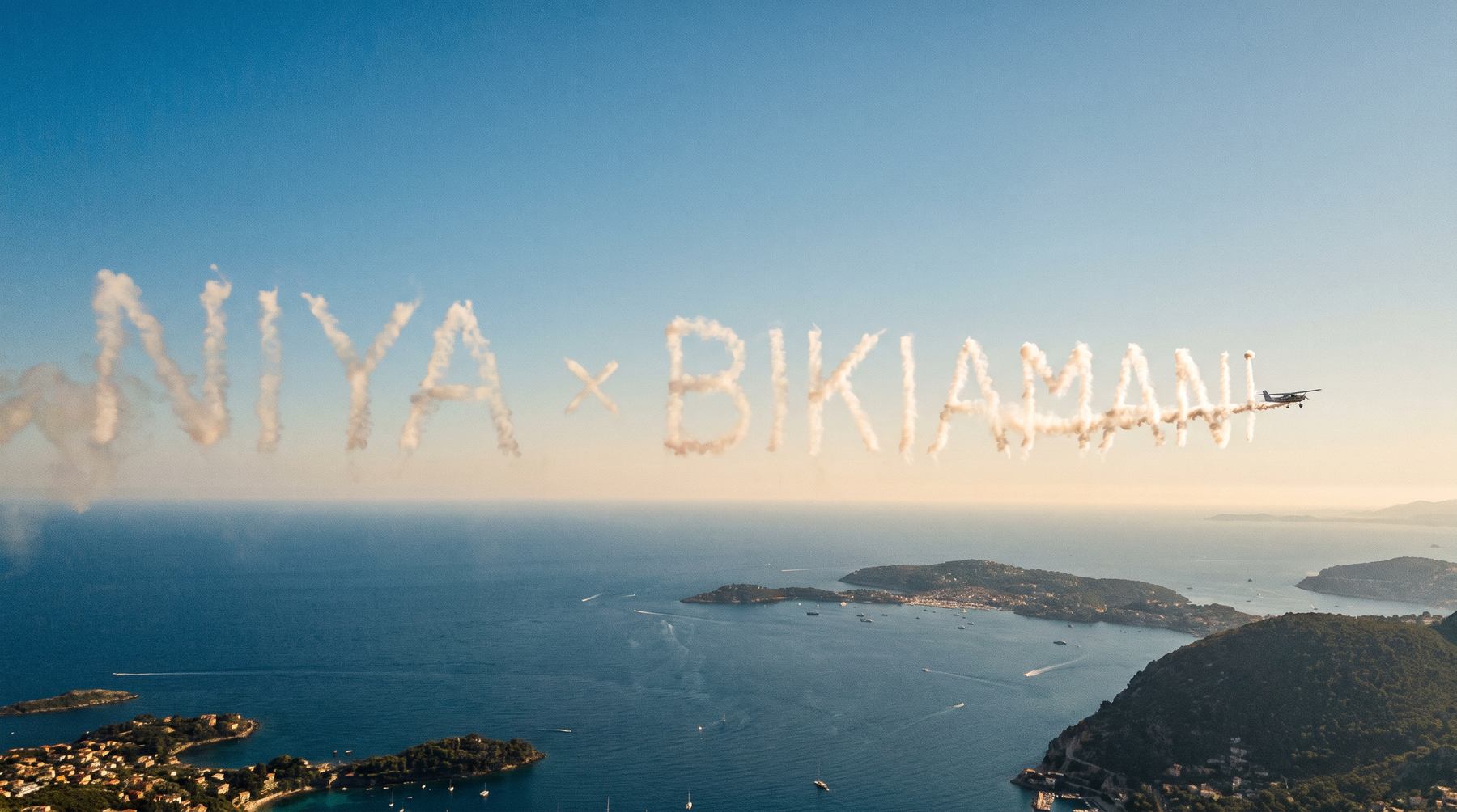 NIYA × Bikiamani written in smoke above the Mediterranean