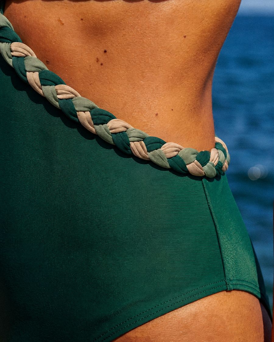 Close-up of the braided trim on the swimsuit